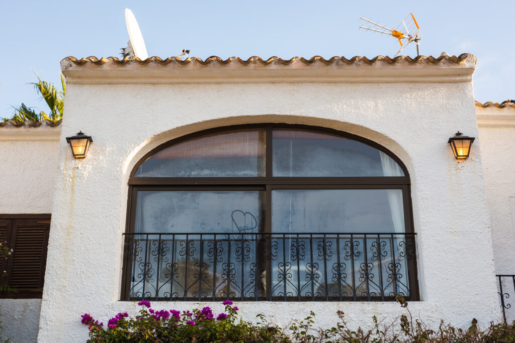 beautiful exterior of newly built luxury home. yard with green grass and walkway