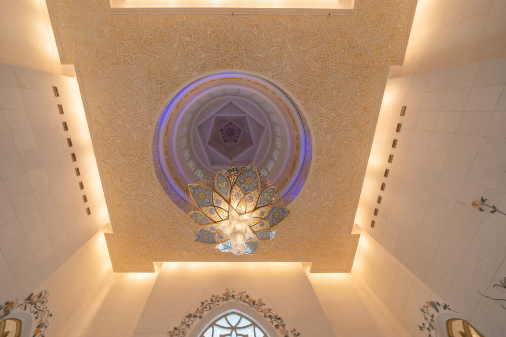 interior of sheikh zayed grand mosque center, abu dhabi. the largest mosque in united arab emirates or uae. muslim or islamic white architecture building. landmark tourist attraction.